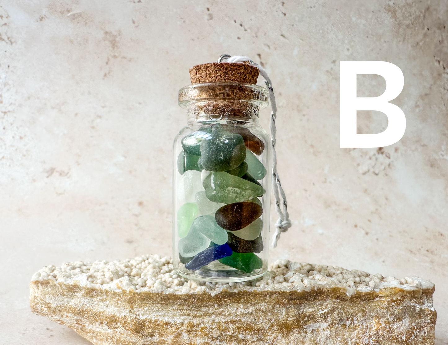 Sea glass in a bottle ornament