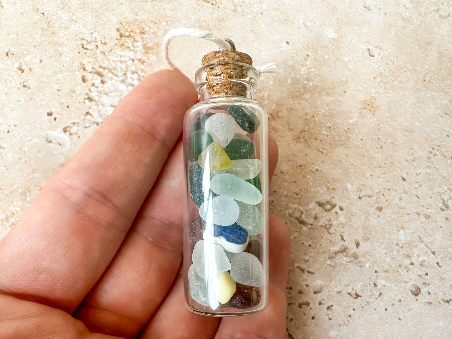 Sea glass in a bottle ornament