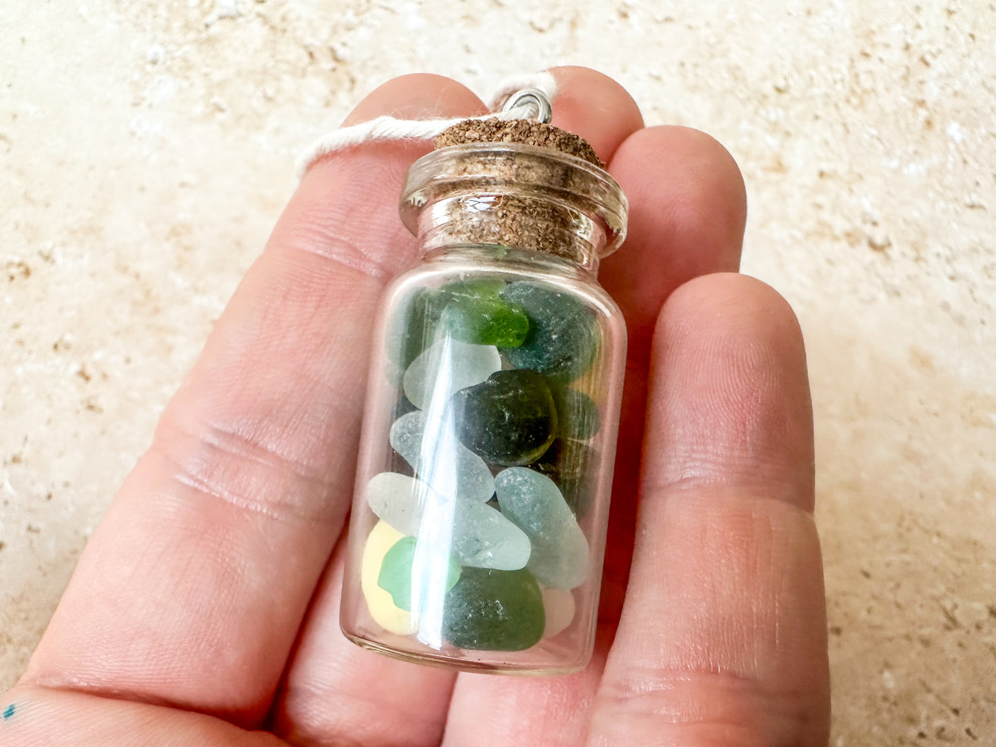 Sea glass in a bottle ornament