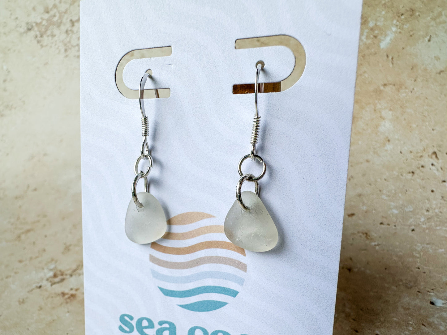 White dangly sea glass earrings