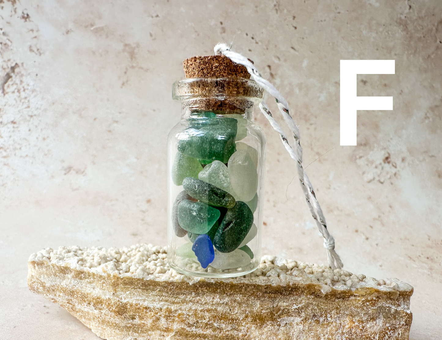 Sea glass in a bottle ornament