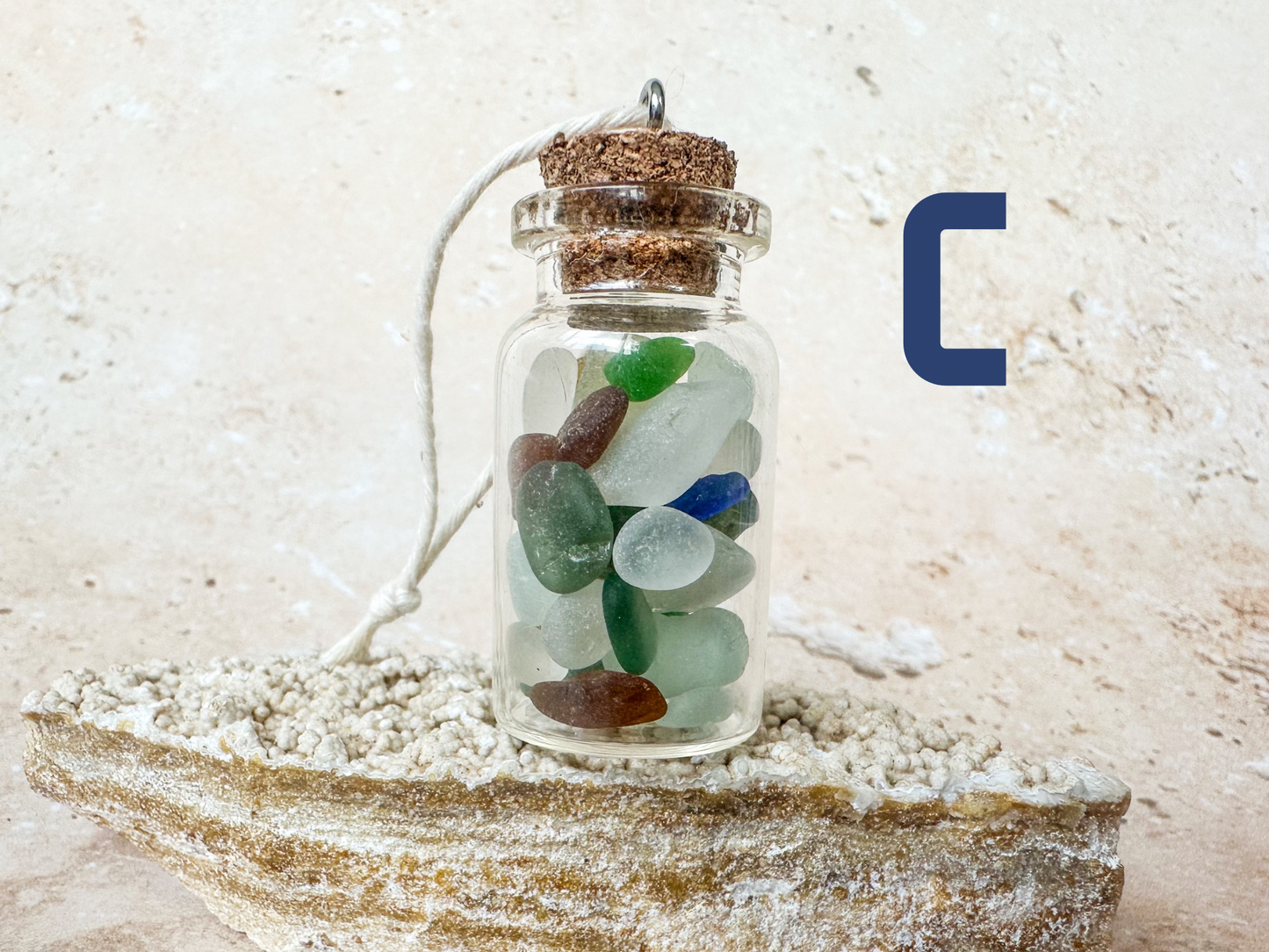 Sea glass in a bottle ornament