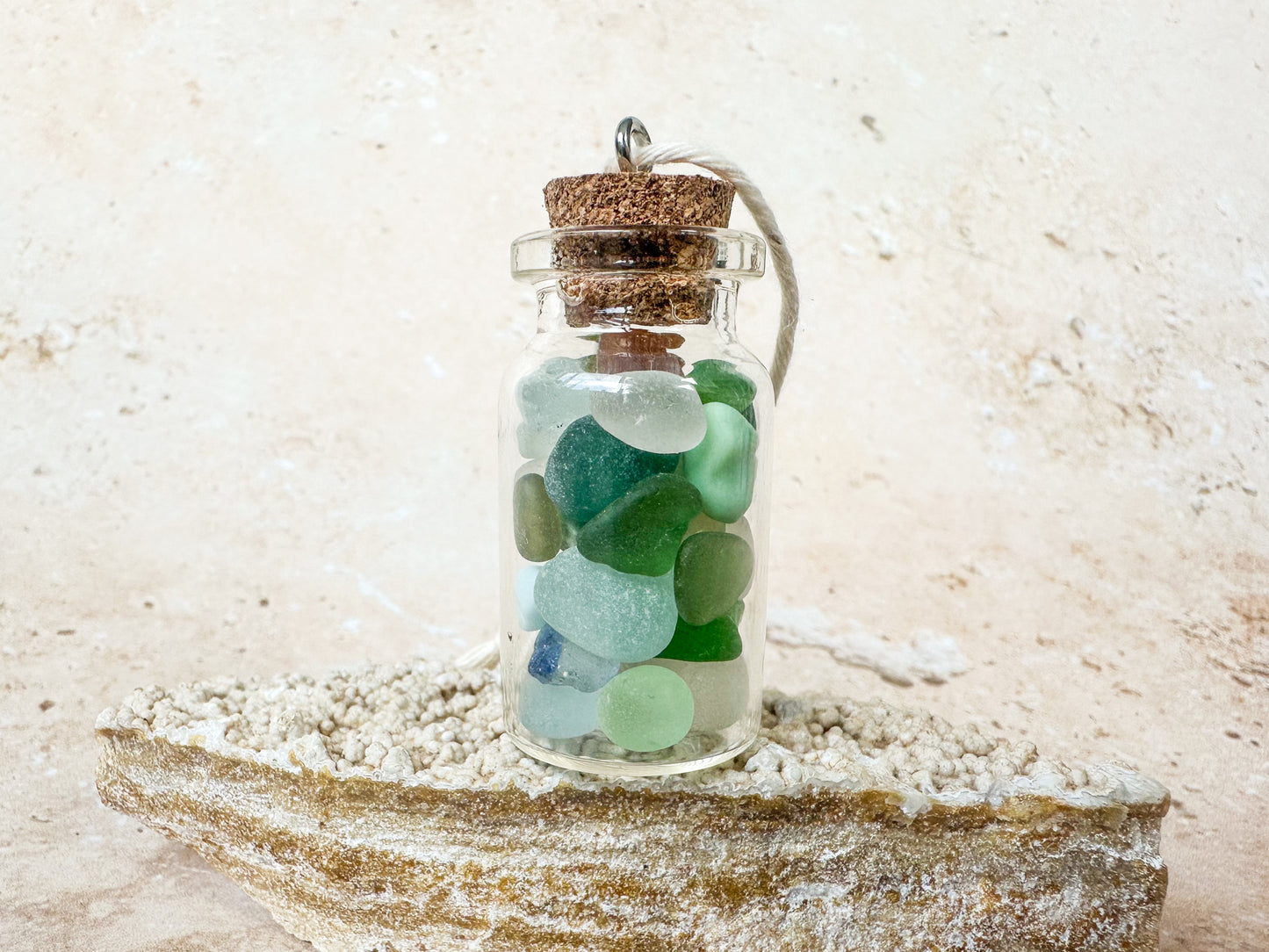 Sea glass in a bottle ornament